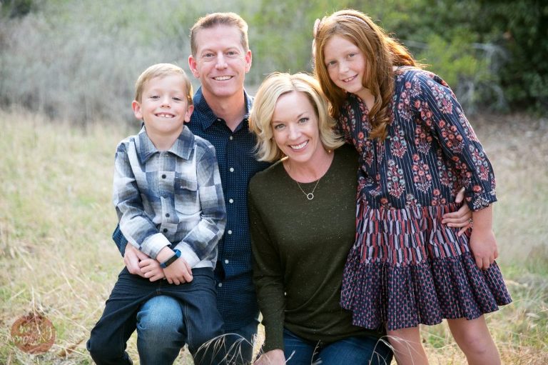 mom, dad, girl and boy wearing fall clothing