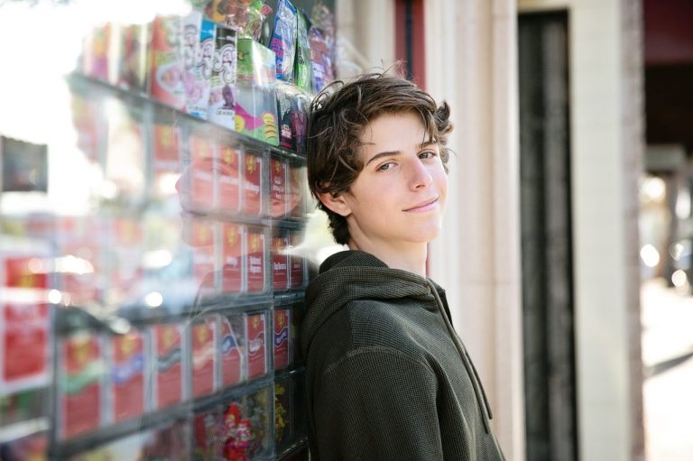 boy outside of candy store