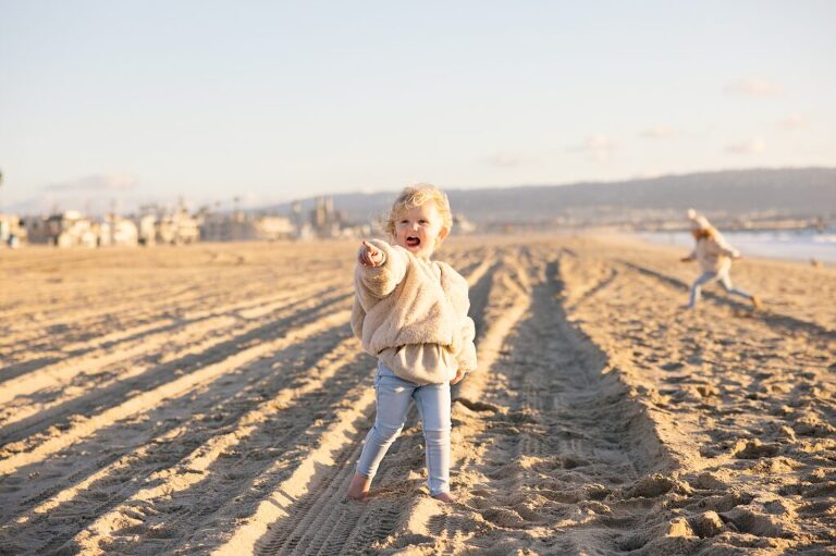 little girls on the sand on the beach